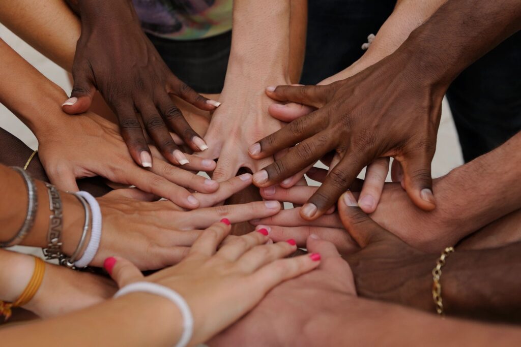 Hands of people coming together