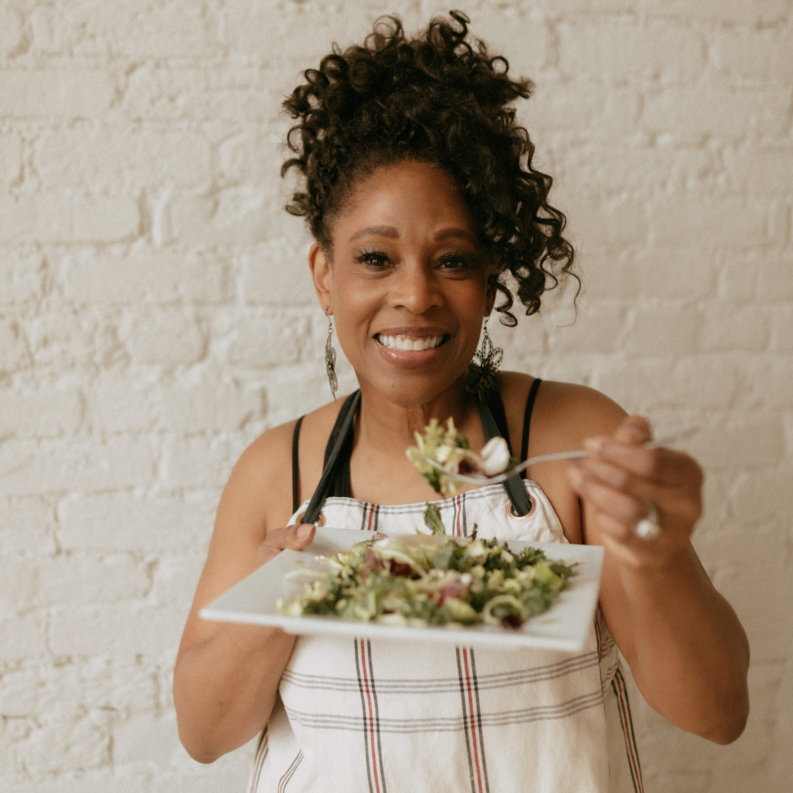 Diesta eating a salad showing balanced nutrition